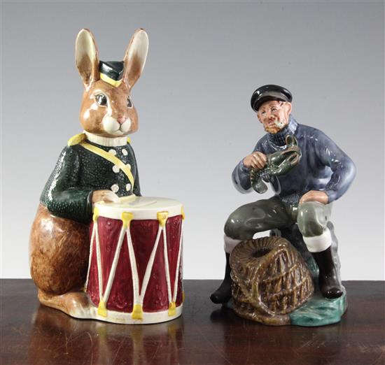 A Royal Doulton Bunnykins bank and a figure The Lobster Man